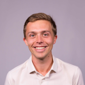 Peter Snell, a young white male with short light brown hair, a big smile and white shirt