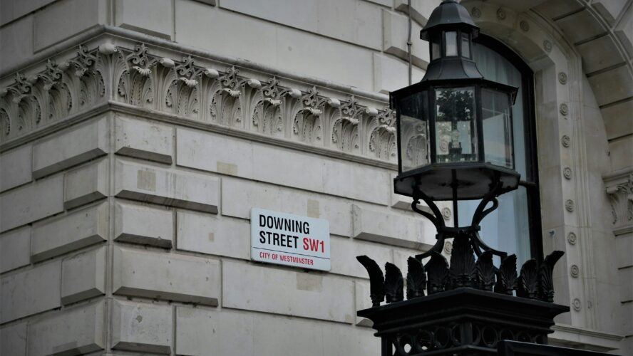 Image showing the side of a building with 'Downing Street' sign on the side, and a lamppost next to it