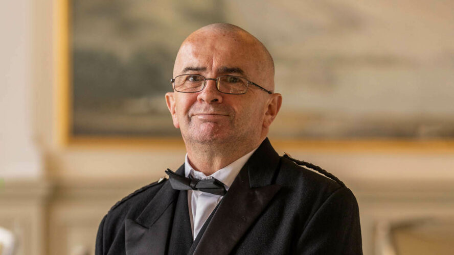 Jimmy, now debt free, in a suit and bow tie at the Scotland Fundraising Dinner