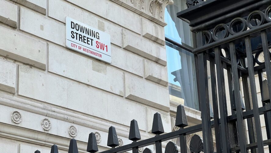 The side of a Downing Street building showing the street sign