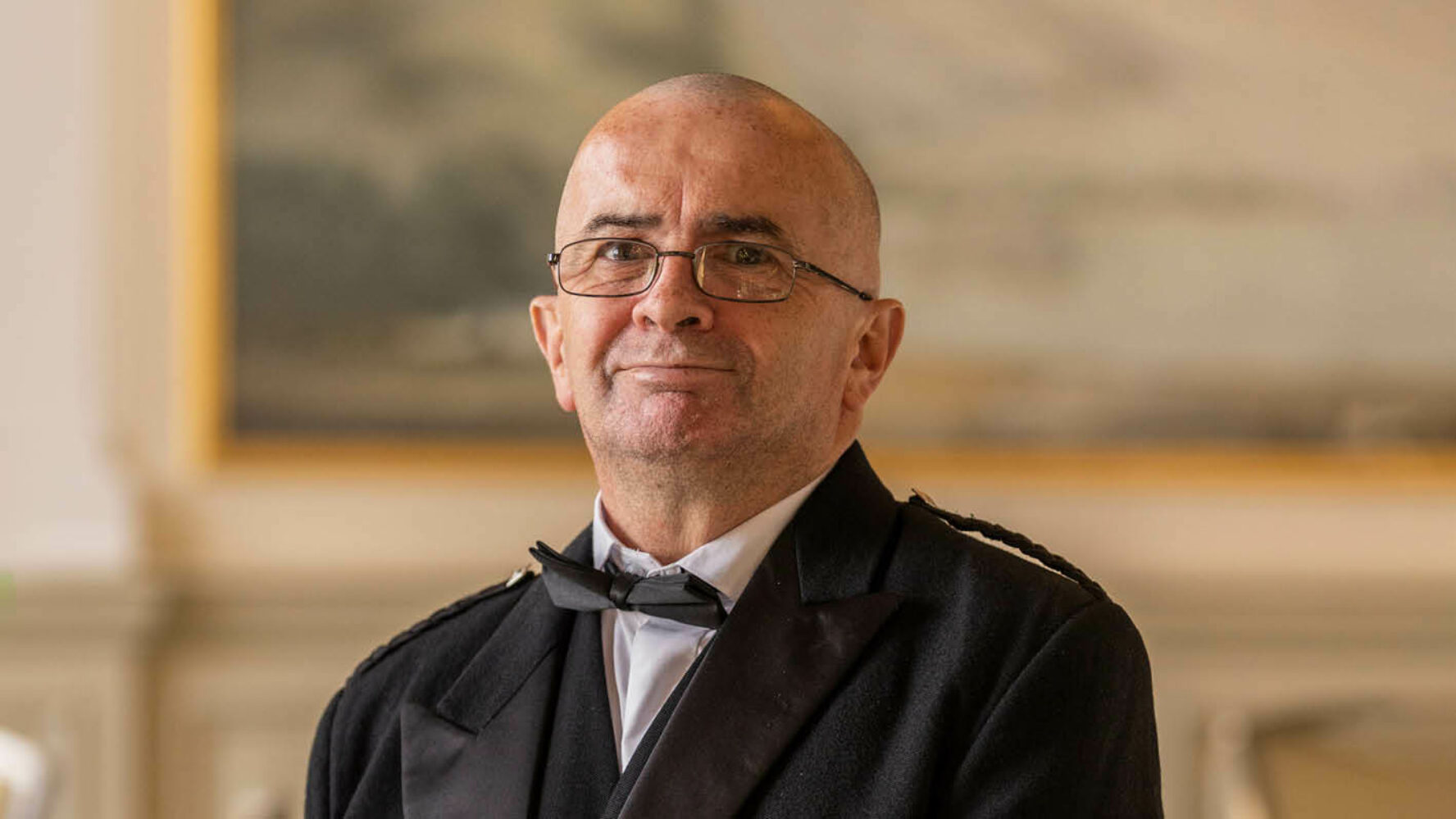 Jimmy, now debt free, in a suit and bow tie at the Scotland Fundraising Dinner