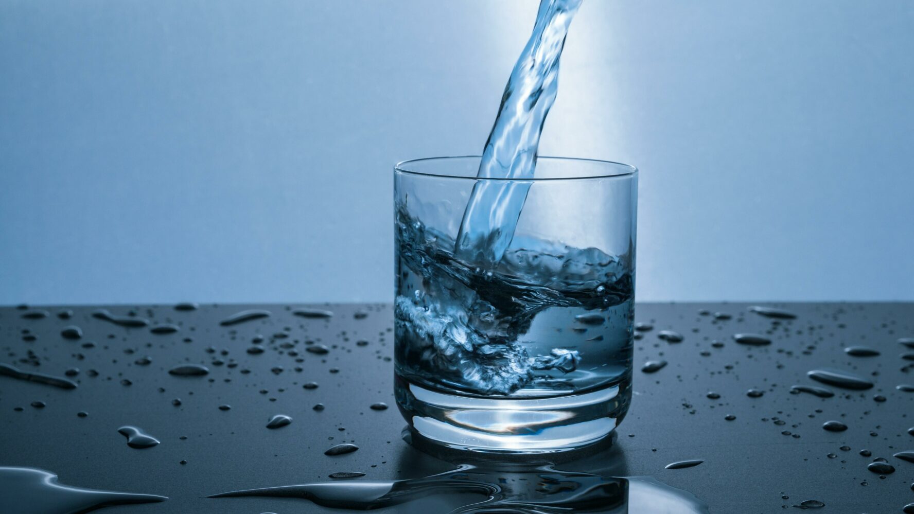 Water being poured into a glass.